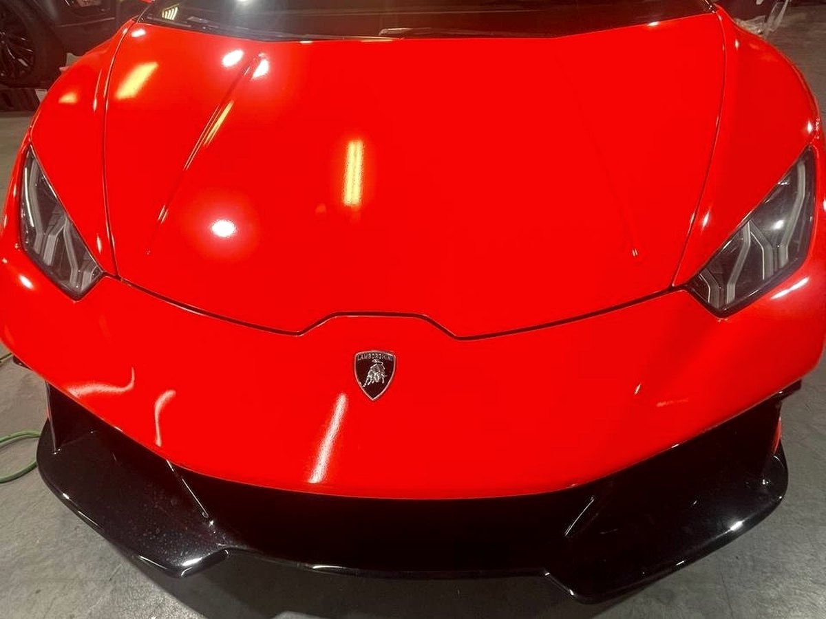 Red Lamborghini Huracán inside Marvel Car Clinic studio
